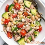 Mediterranean tuna salad in a rustic ceramic bowl
